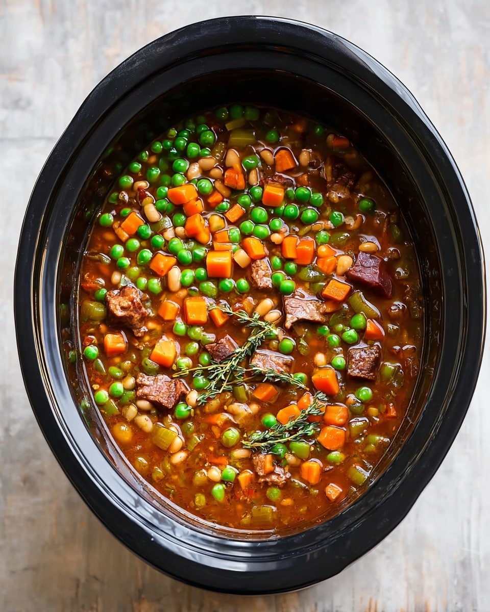 A black slow cooker filled with a colorful stew showing three main layers: the top layer is bright green peas scattered over the surface; underneath is a thick mix of small orange carrot cubes and light green celery pieces; the base layer is a rich brown broth filled with white beans and chunks of browned meat, all topped with a few sprigs of fresh thyme. The slow cooker sits on a white marbled surface. photo taken with an iphone --ar 4:5 --v 7