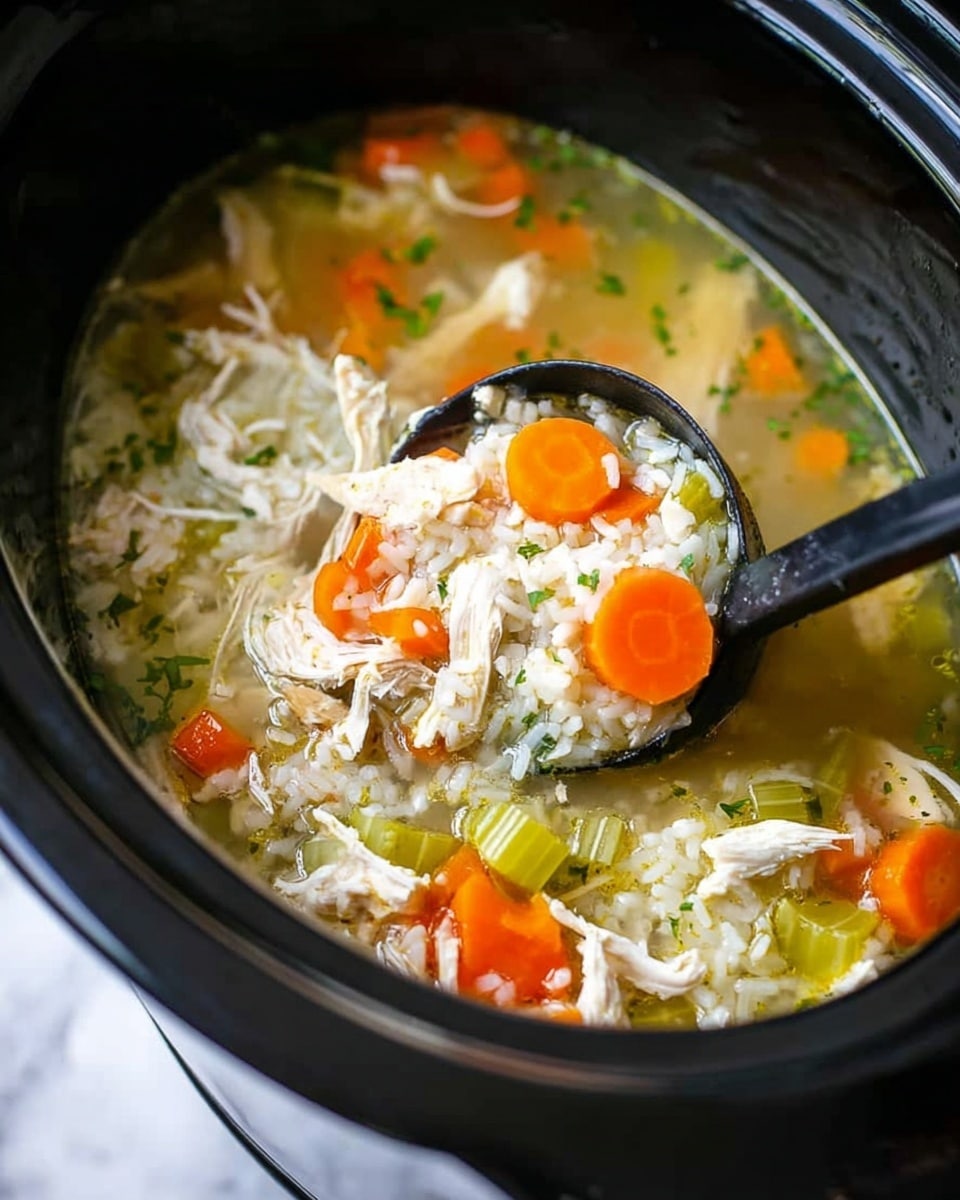 A close-up image of a black slow cooker filled with chicken soup. Inside, there are shredded white chicken pieces, bright orange carrot slices, and light green celery chunks mixed with white rice in a clear broth. A black ladle scoops a mix of chicken, carrots, celery, and rice from the soup. The background surface is white marbled texture. photo taken with an iphone --ar 4:5 --v 7