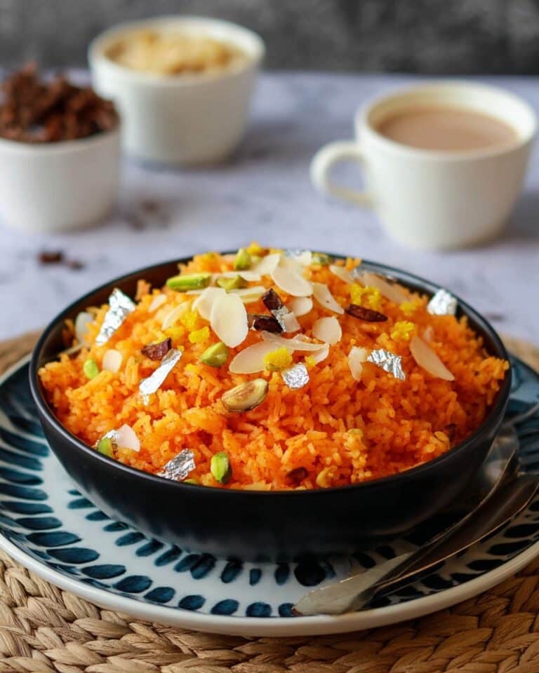 Sweet Sella Rice Pudding (Zarda) with Nuts, Coconut, and Silver Leaf Recipe